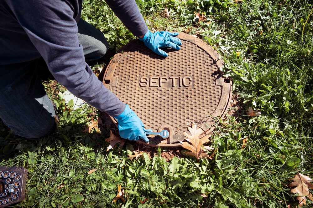 Emptying household septic tank. Cleaning sludge from septic system.